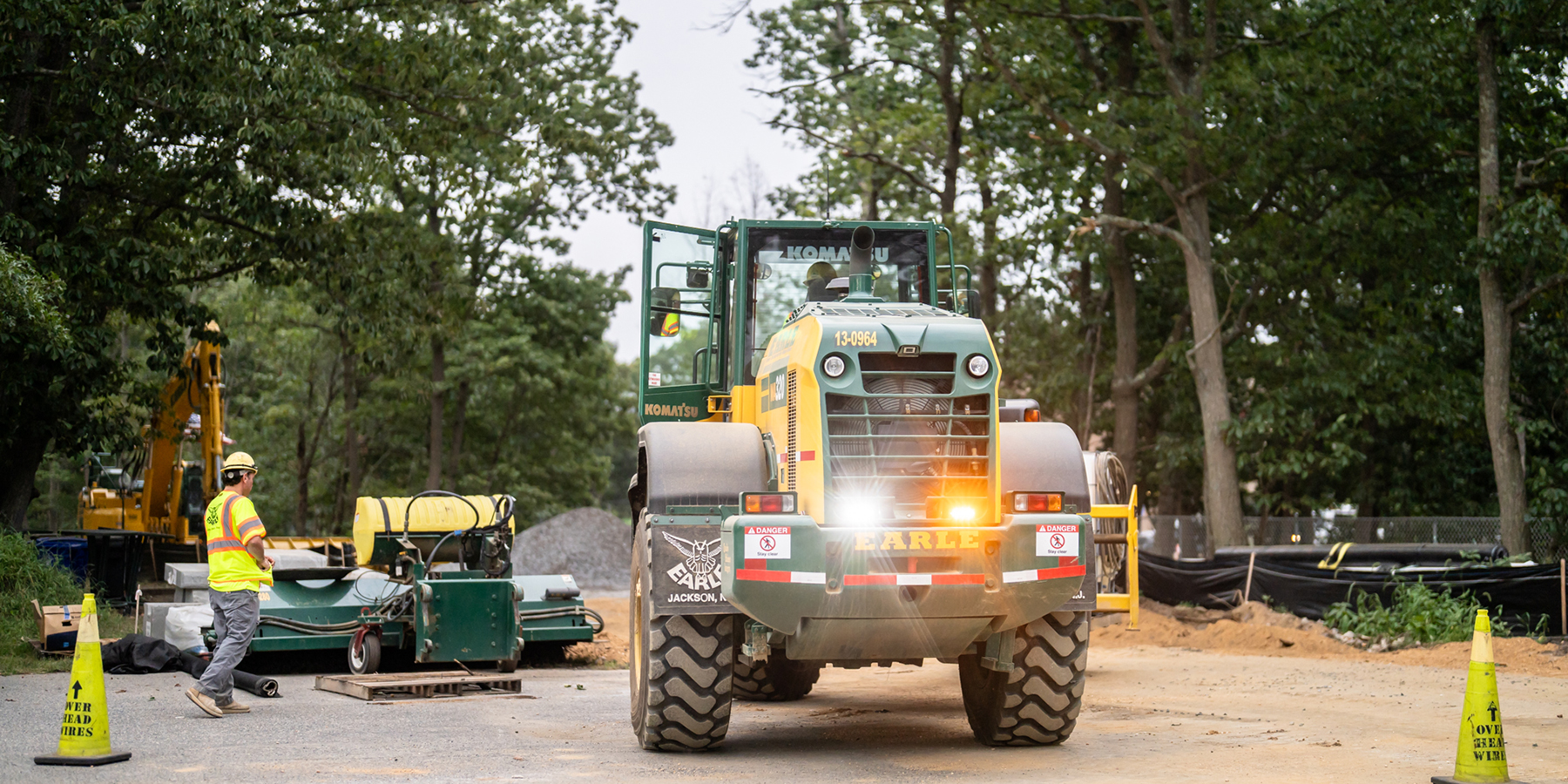 An Earle tractor drives through a construction site in New Jersey.