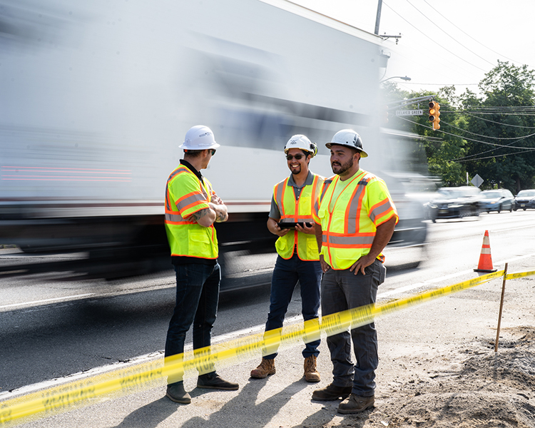 Earle team members discuss safety protocol on a site in NJ.