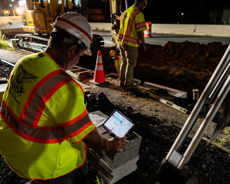 An Earle employee uses data analysis on a New Jersey construction site.