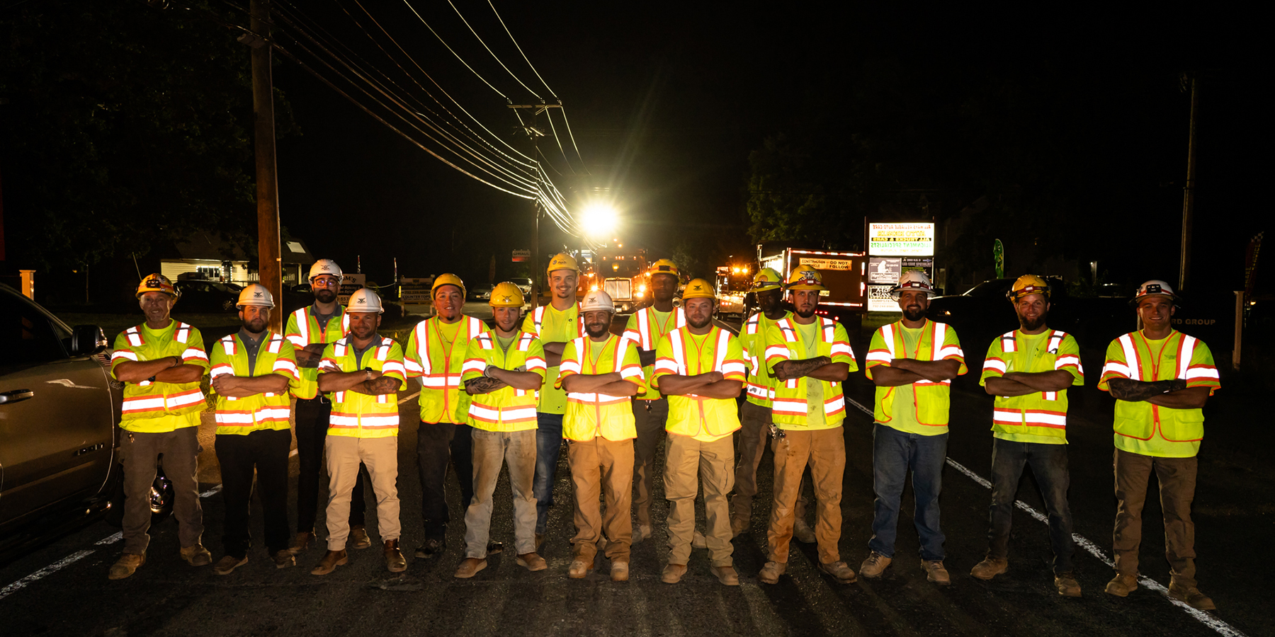 Earle employees in personal protective wear smile in New Jersey.