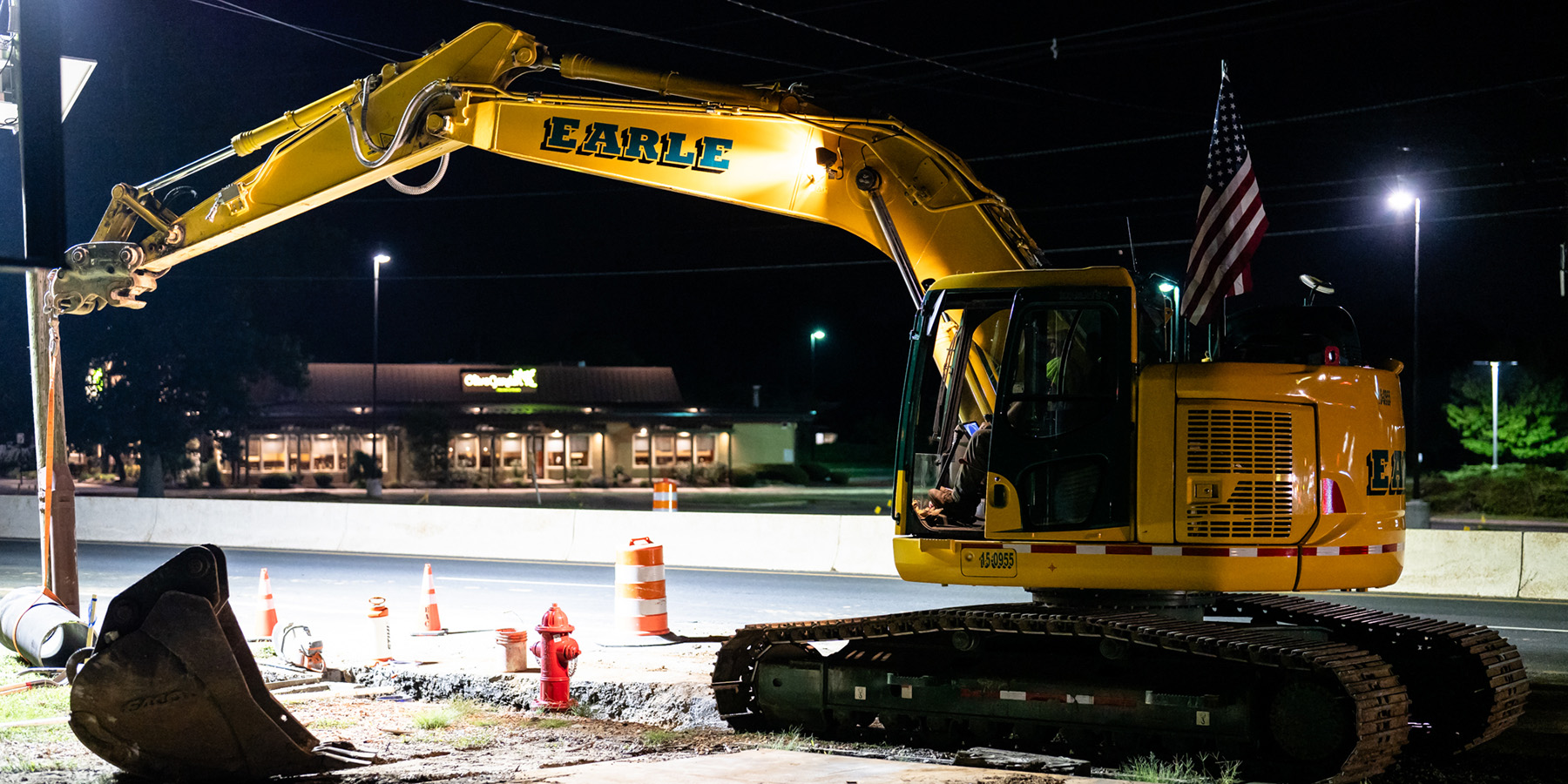 An Earle crane rests at a night time job site in New Jersey